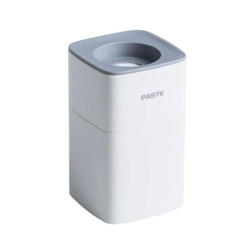 Dispensador Pasta de Dientes de pared blanco