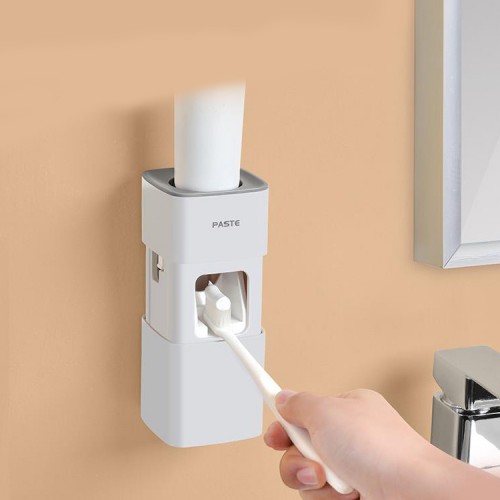 Dispensador Pasta de Dientes de pared blanco