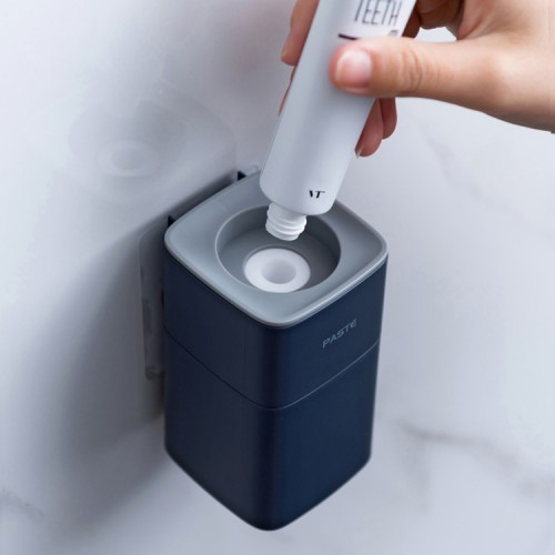 Dispensador Pasta de Dientes de pared blanco